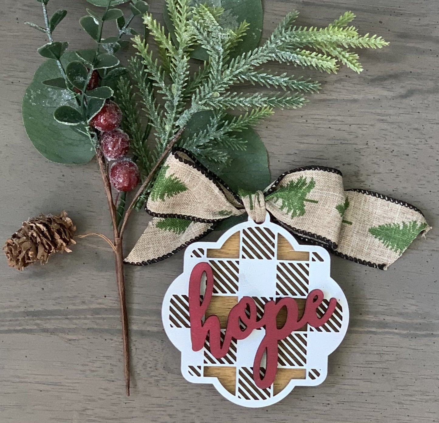 Wooden multi layered ornate whitewashed adorn ornament with cursive wording. Customize the color and wording on each ornament to add to your Christmas decor. Single ornament only